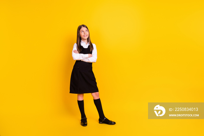 Full length body size photo schoolgirl in uniform looking blank space isolated bright yellow color b