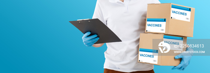 the man delivers the vaccine. Placing VACCINE label on the cardboard box