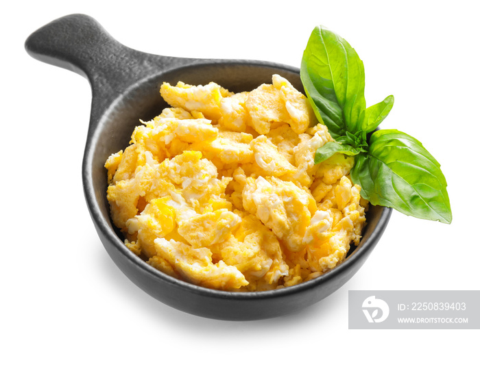 Frying pan with scrambled egg on white background