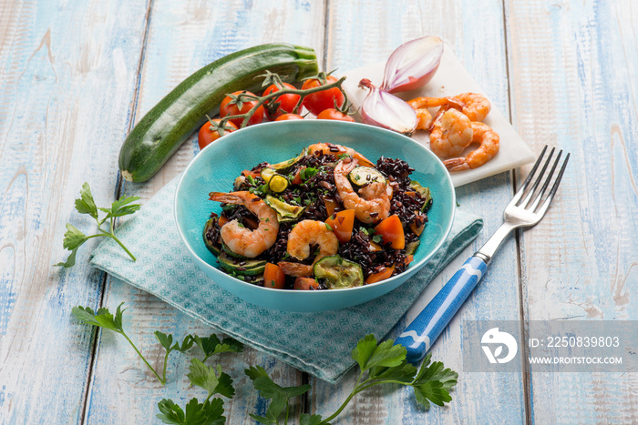 black rice with shrimp zucchinis and tomato