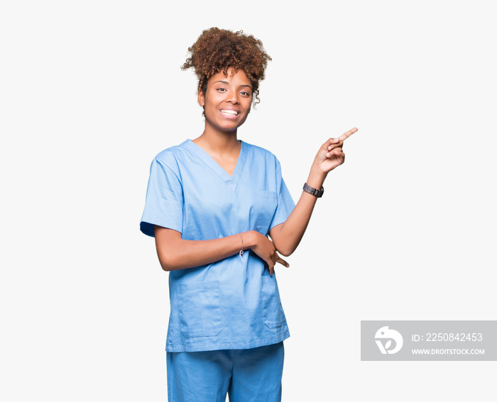 Young african american doctor woman over isolated background with a big smile on face, pointing with