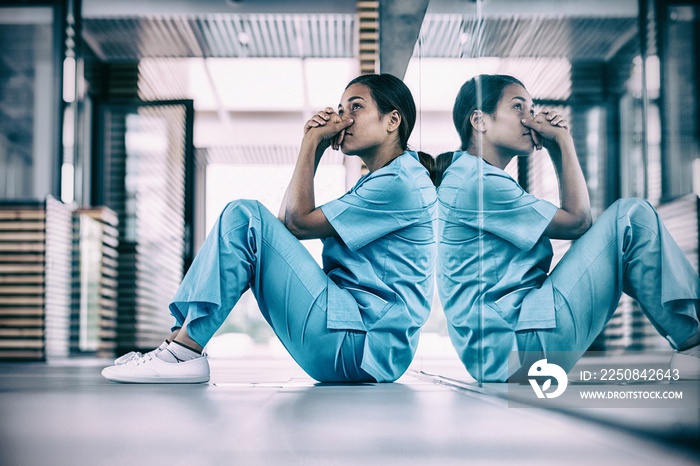 Nurse sitting on floor