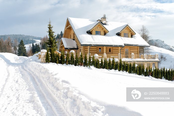 Wooden house in the mountains in winter