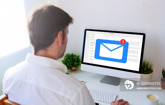 man managing mail on computer