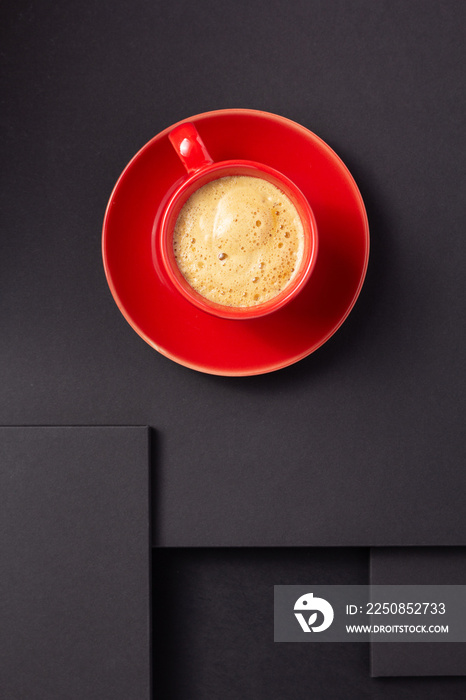 cup of coffee at abstract black background texture