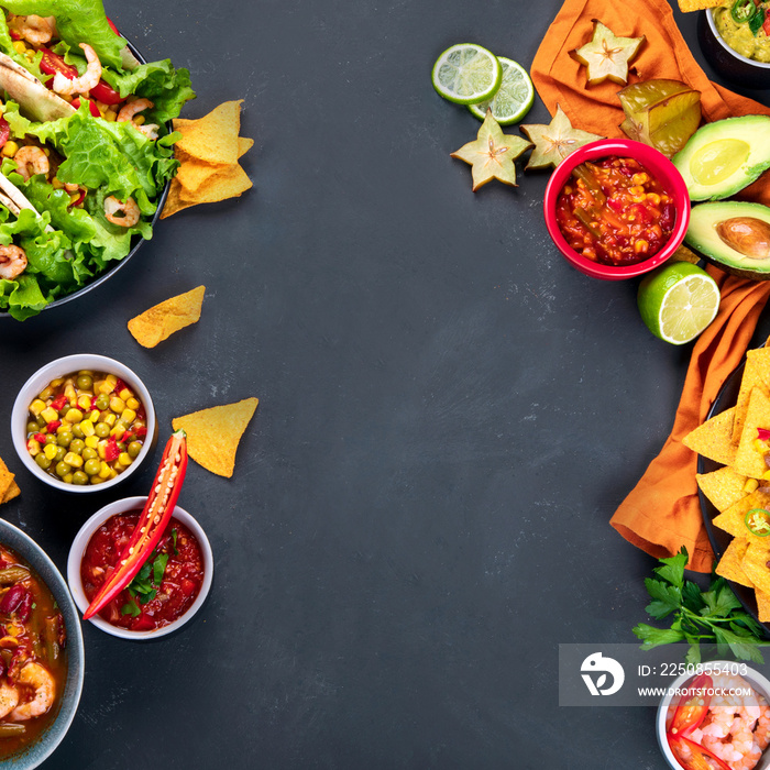 Hispanic mexican food, nachos, guacamole, meat tacos on dark background