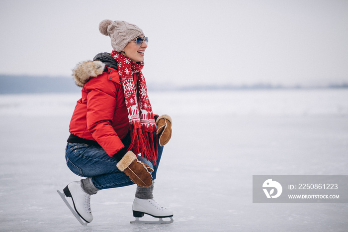 Woman ice skating at the lake