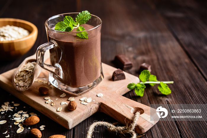 Nutritious smoothie made of chocolate, oatmeal, honey and almond milk