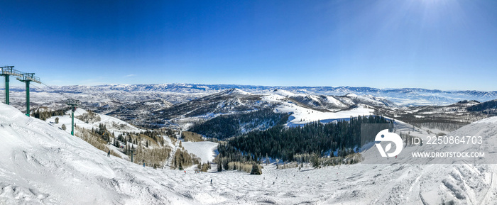 Panoramic view of Wasatch mountains at Deer Valley ski resort from near the top of Empire lift.