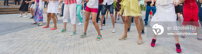 Social dance and flashmob concept - Fun and dance with in the summer on a city street. Close-up of d