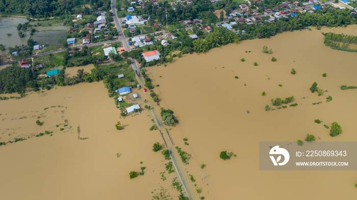 Aerial top view of Flooded rice paddies and the village, View from above shot by drone