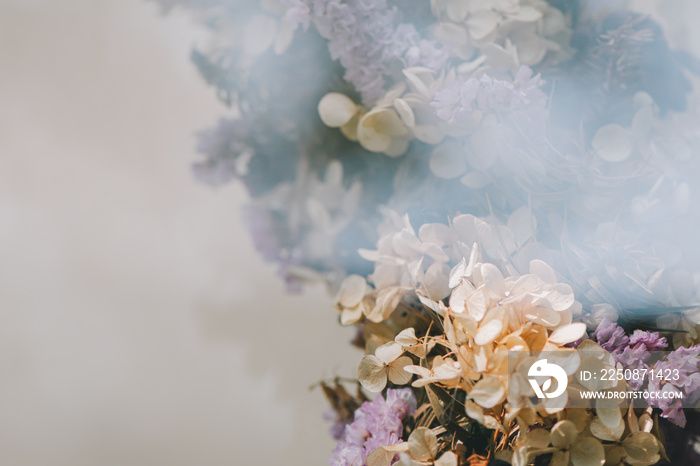 The view through the glass of dry flowers, Cinematic tone.