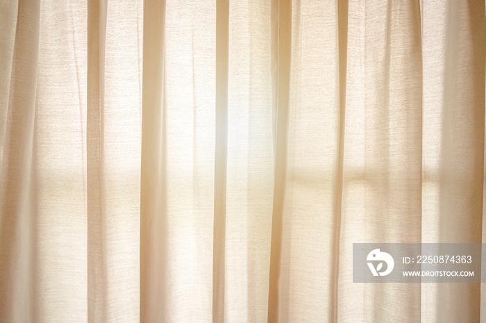 Golden sunlight through the transparent green curtain in bed room. Morning refresh concept wallpaper