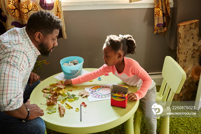 Father and daughter enjoying handicraft activity