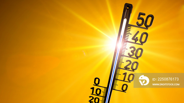 Hot summer or heat wave background, glowing sun on orange sky with thermometer