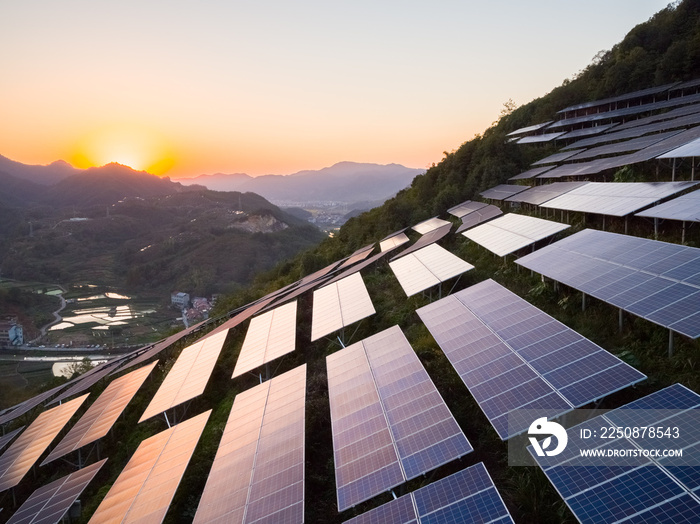 aerial view of solar power panels on hill