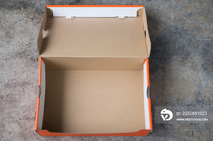 Open brown and orange cardboard box