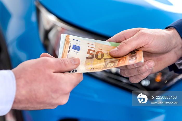 Male hand giving euro banknotes for dealer close up