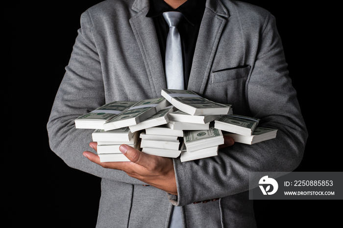 Man holding Money in hand at Black Background, Man receive a lot Money from Trading, Business Succes