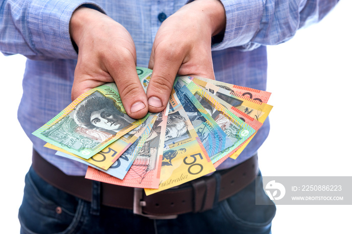 Man showing fan of australian dollar banknotes