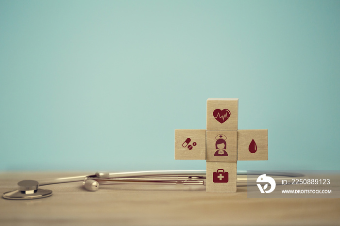 Healthcare concept about of health and medical insurance, arranging wood block stacking with icon he