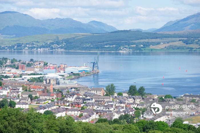 Aerial view of Greenock shipbuilding crane and Gourock ships at the coastal town from above