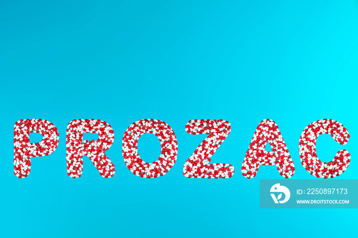 inscription prozac white and red pills on a blue background top view. concept of stress relieving an