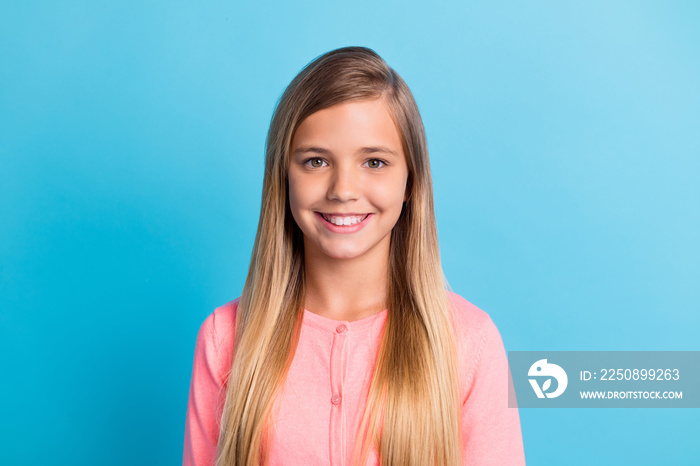 Photo portrait of smiling girl isolated on pastel blue colored background