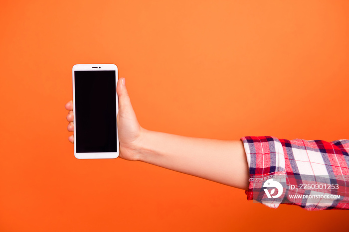 Cropped close up photo she her lady arm hand white telephone iphone showing instagram novelty hiding