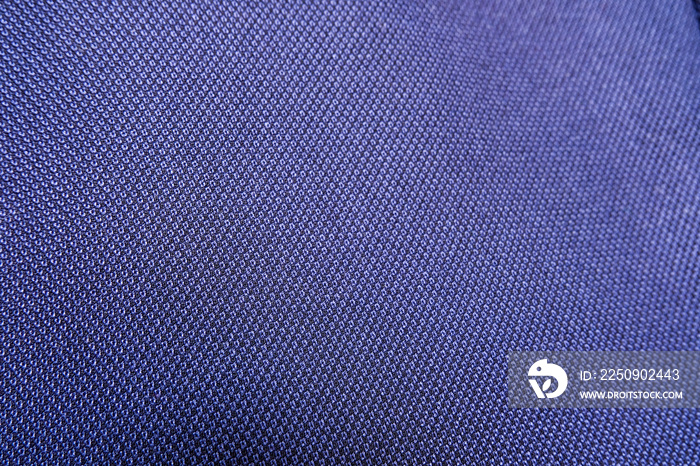 午夜深蓝色正式西装布织物表面特写。进口羊毛织物纹理