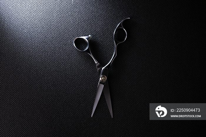 professional scissors on black background