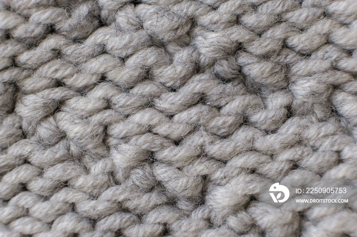 Handmade grey knitting wool texture background close up