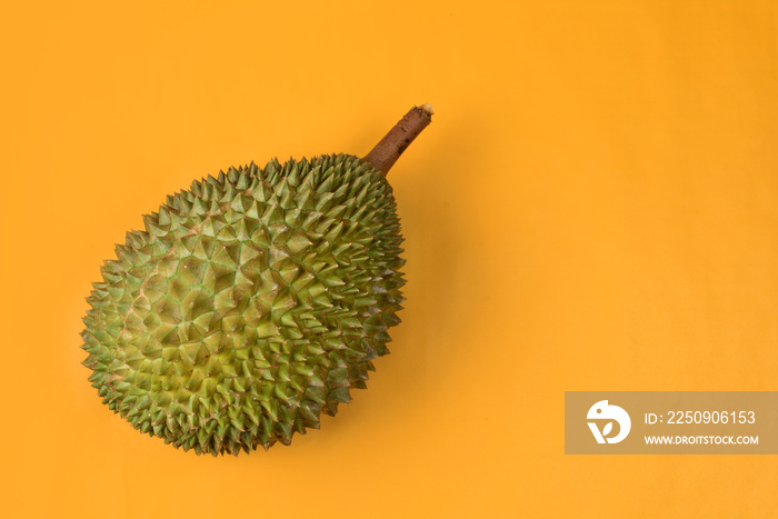 durian  on bright yellow background with copyspace