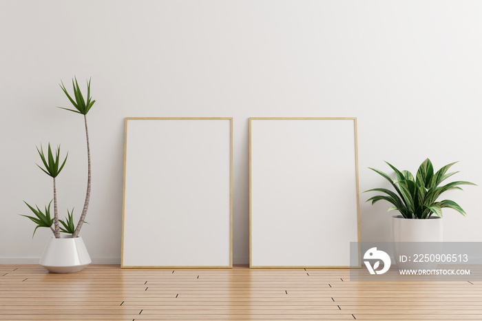 Two vertical wooden photo frame mockup on white wall empty room with plants on a wooden floor