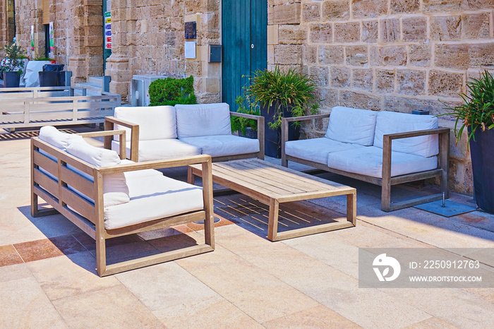 Modern summer furniture on terrace near the cafe, outdoor resort