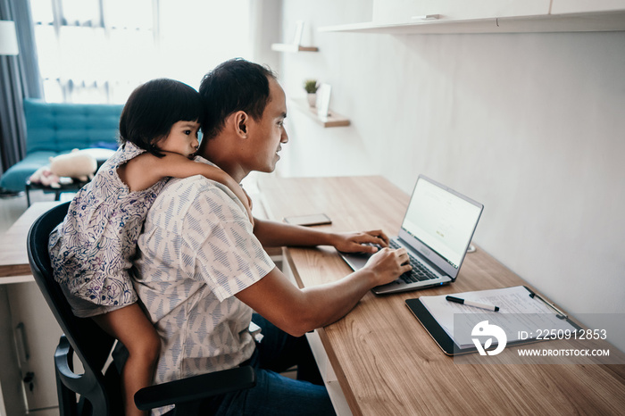 young business man parent interrupts by her daughter while working in the office