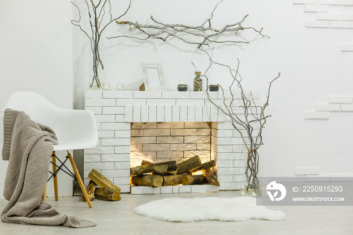 White fireplace in light room with Christmas decoration