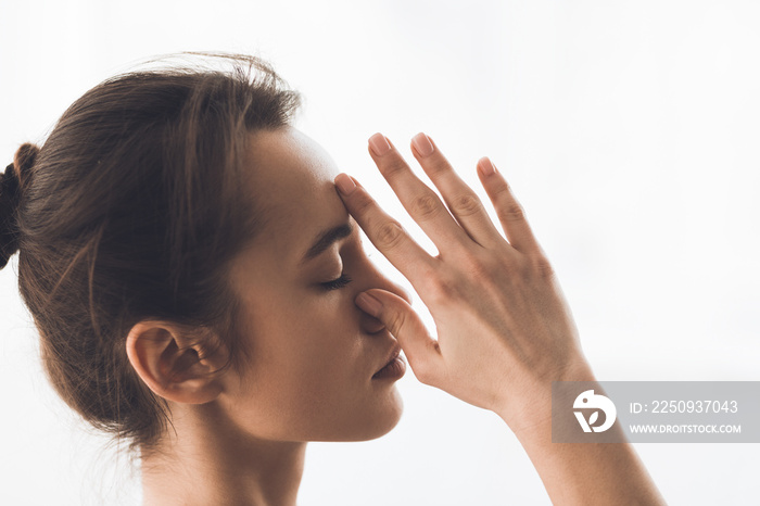 Relaxed woman meditating and doing breath exercise