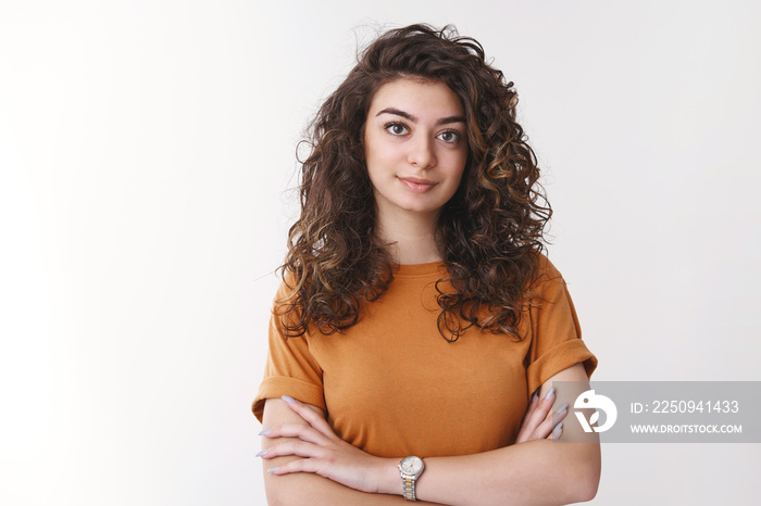 Young determined armenian curly-haired female university student listen carefully asignment look con