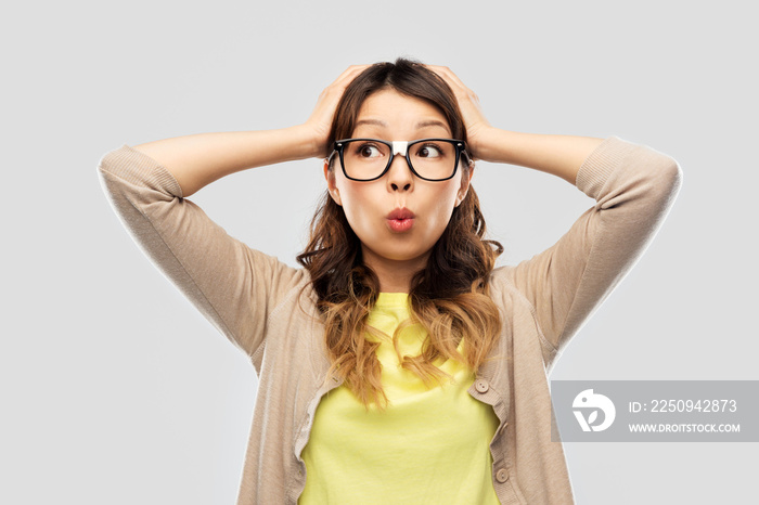 stress, education and school concept - asian woman or student in glasses fixed by tape holding to he