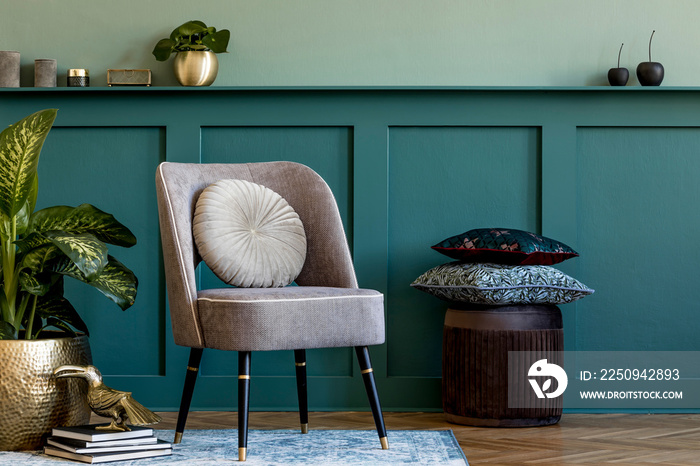 Modern composition of living room with design gray armchair, gold pot with beautiful plant, pouf, pi