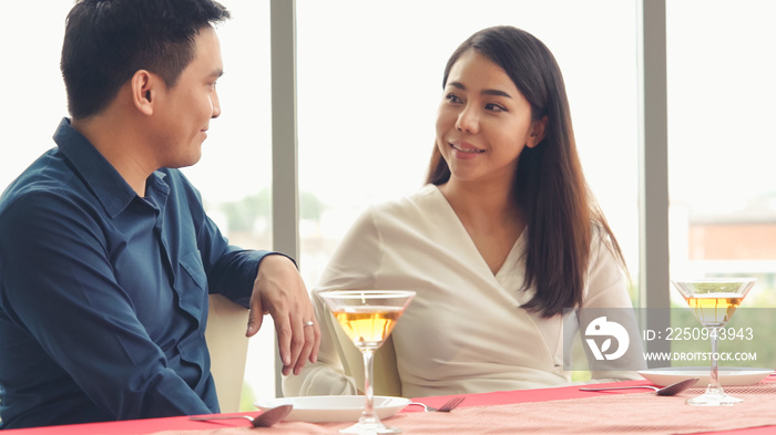 Happy romantic couple eating lunch at restaurant . Couple anniversary celebration and lifestyle .