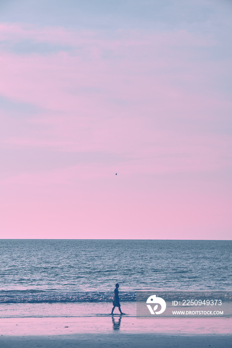 Girl on the beach during sunset