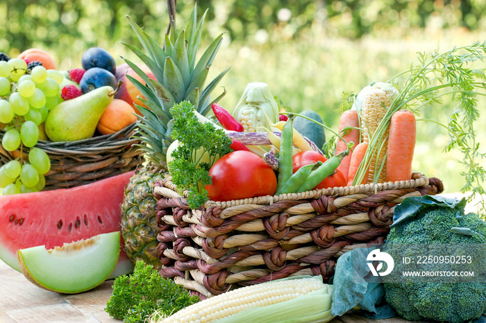 Healthy fresh food in healthy diet, organic fruit and vegetable in wicker basket on table