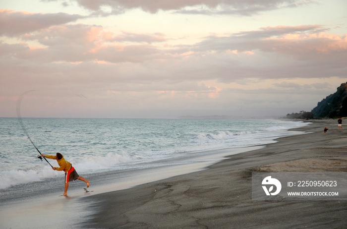 Beach Fishing in New Zealand at sunset