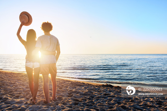 Couples during a sunrise at the beach