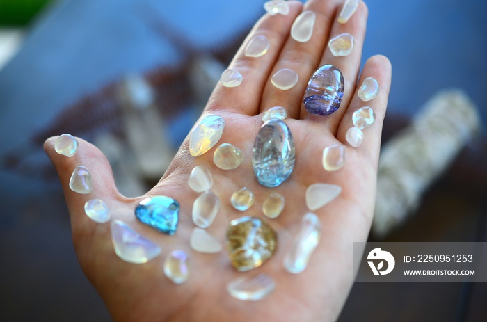 Bright, healing crystals and palo santo. Mystical, low exposure macro photo of crystals. Healing sto