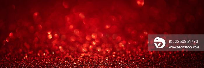 Banner 3:1. Abstract glitter lights on red background. Christmas greeting card. Christmas or New Yea