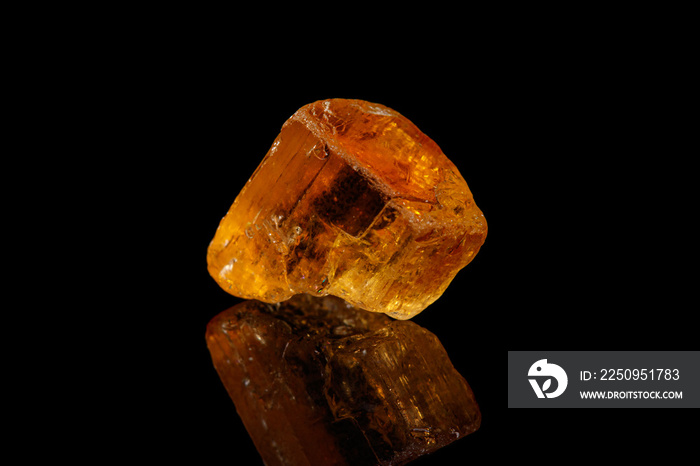 Macro stone mineral yellow topaz on a black background