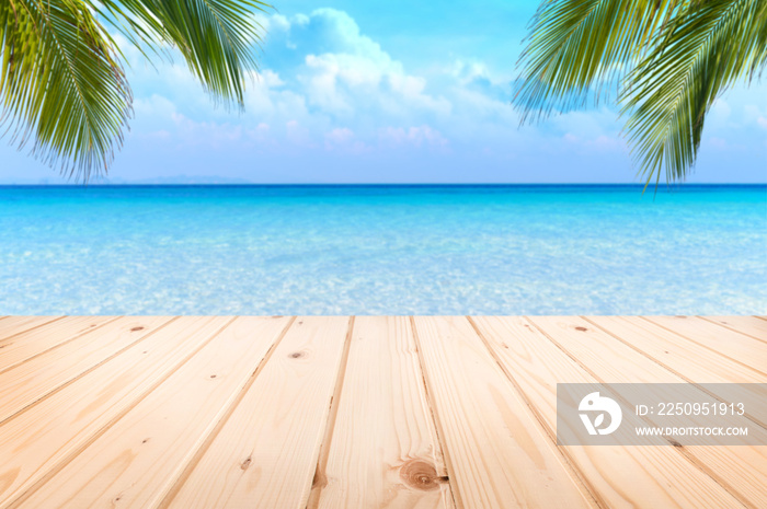 Wooden floor or plank on sand beach in summer. For product display.Calm Sea and Blue Sky Background.